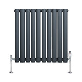 Oval single column radiator in anthracite grey, featuring sleek vertical bars and polished chrome valves for modern decor