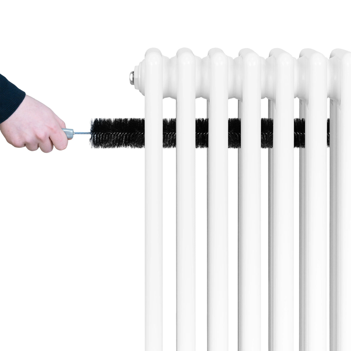 Traditional white 4 column radiator with a hand cleaning it using a brush, showcasing its smooth finish and classic design
