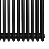 Traditional black 4 column radiator with a sleek, glossy finish, showcasing its sturdy metal construction and elegant design