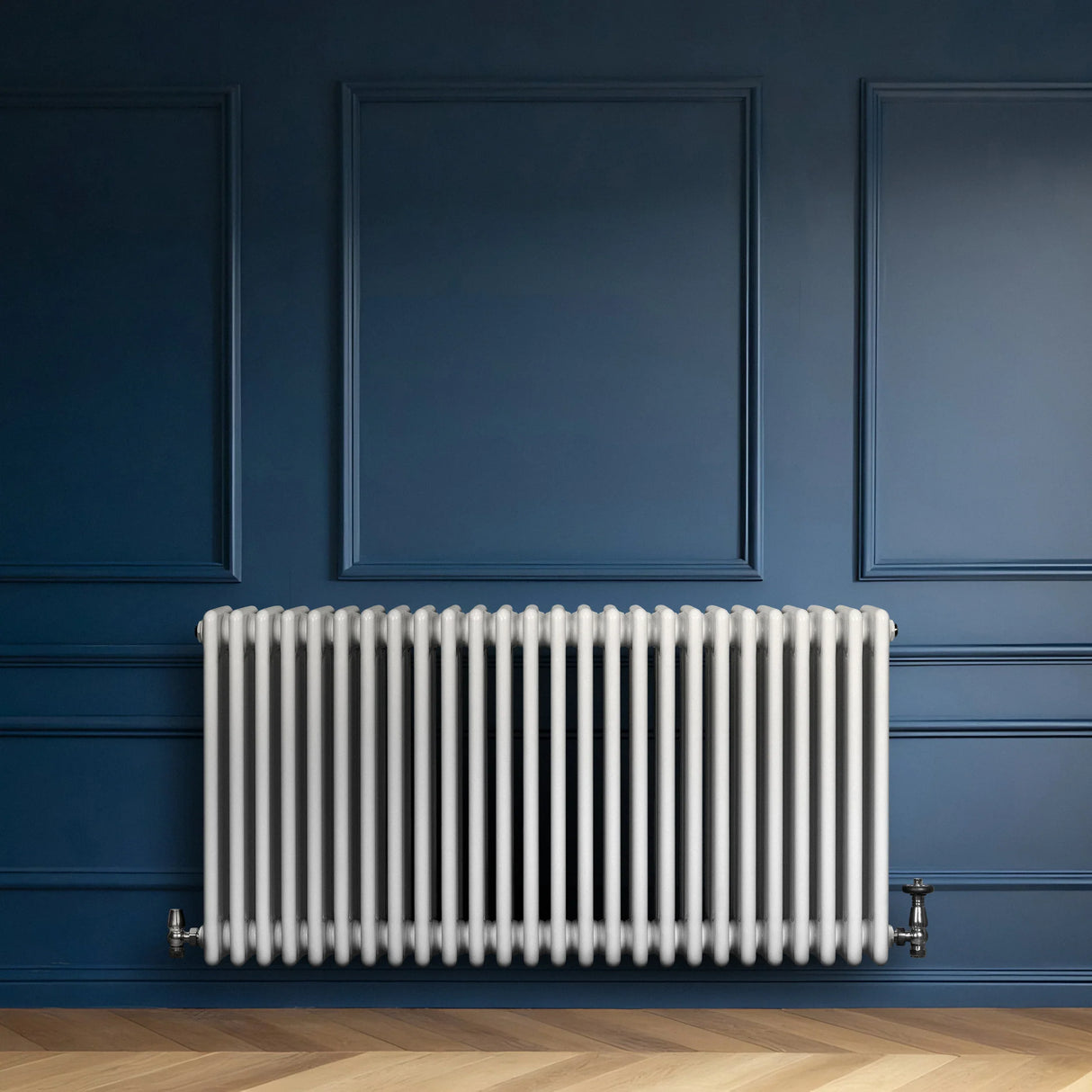 Traditional white 4 column radiator, 600 x 1190mm, mounted on a blue wall, featuring a sleek, glossy finish and vertical bars