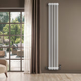 Traditional white 4 column radiator, 1800 x 290mm, mounted on a wall beside large windows, showcasing a modern interior design