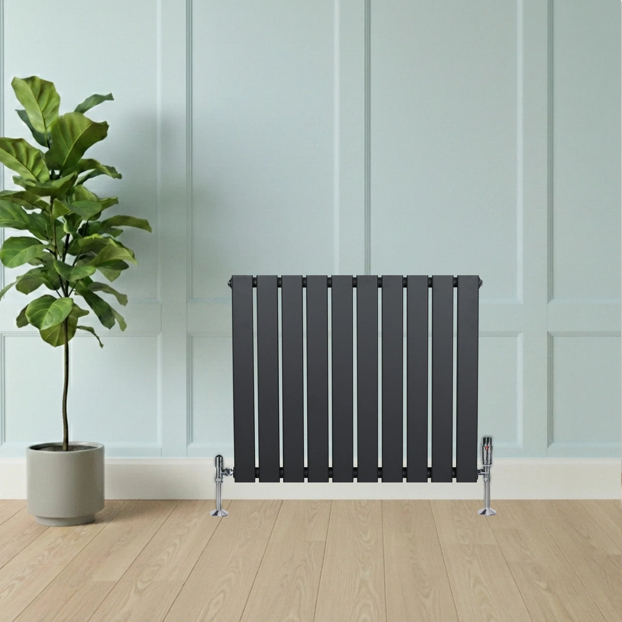 Flat single column radiator in anthracite grey, featuring a sleek design with vertical slats, positioned against a light blue wall and wooden floor