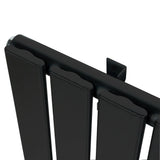 Flat single column radiator in sleek black finish, 600 x 700mm, featuring smooth, modern lines and a minimalist design for efficient heating
