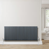 Oval single column radiator in anthracite grey, featuring sleek vertical lines and a modern design, mounted against a light wall
