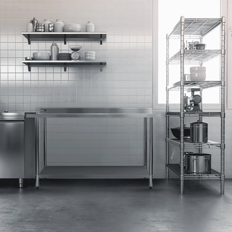 Modern kitchen featuring stainless steel work table, open shelves with dishware, and a metal storage rack against tiled walls