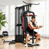Multi gym workout station in black with red accents, featuring adjustable seat, pull-up bar, and various exercise attachments in a bright indoor setting